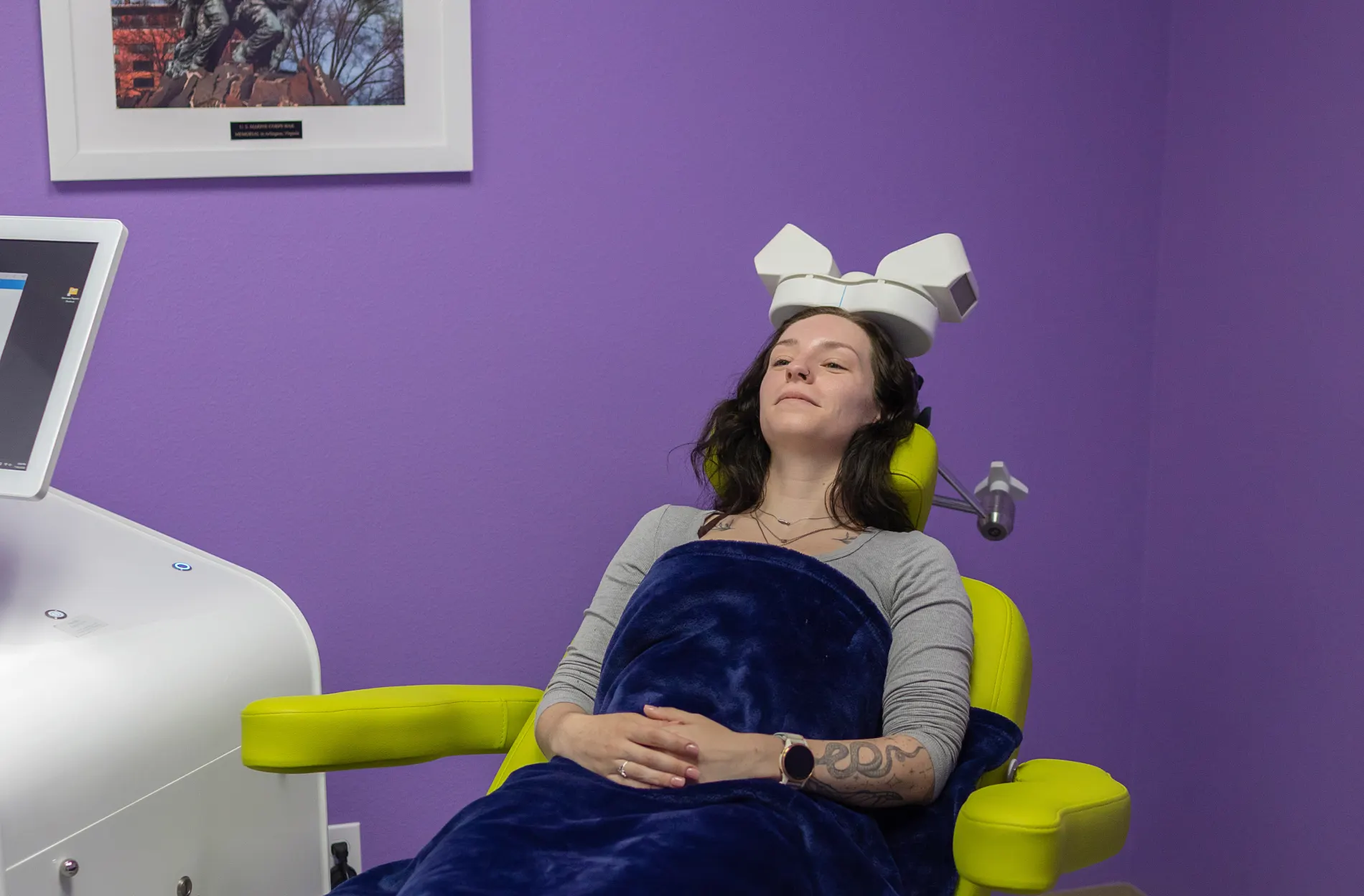 Patient receiving TMS therapy at Karma TMS