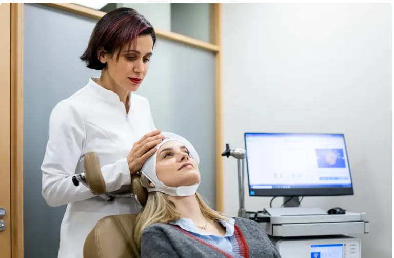 Patient receiving TMS therapy