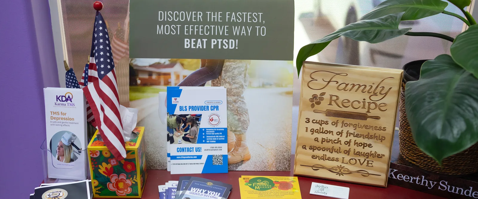 Veteran PTSD and TMS resources displayed at the Karma TMS clinic